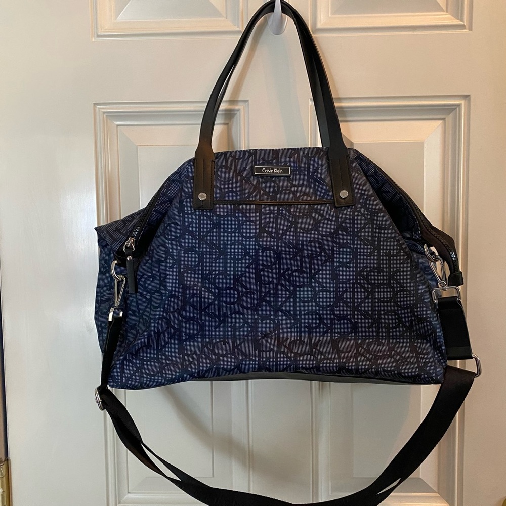 Calvin Klein lightweight blue medium size nylon duffel travel bag.